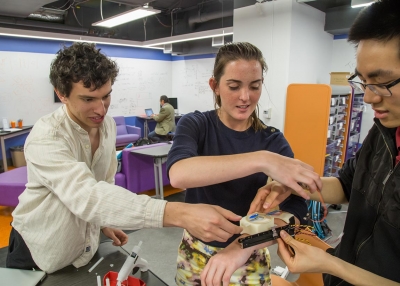 Students prepare a device they designed that allows visually impaired people to experience color.