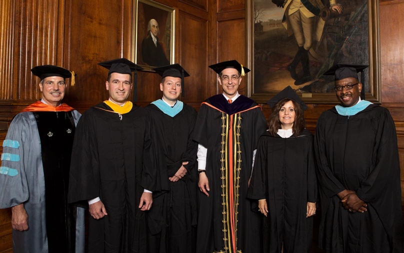 In the Faculty Room of Nassau Hall, Director of the Program in Teacher Preparation Christopher Campisano (left) and Princeton President Christopher L. Eisgruber (third from right) meet with four outstanding New Jersey secondary school teachers on Commencement Day. They are (from left) Richard Wertz, Matthew Morone, Barbara Fasano and Ronald Duncan Jr.