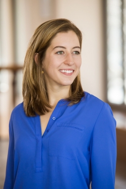 Photo of Caroline Trippel standing in the Princeton Computer Science building.