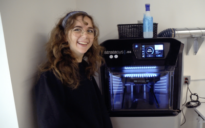 Maxine Perroni-Scharf with a 3D printer in the Princeton Robotics Lab