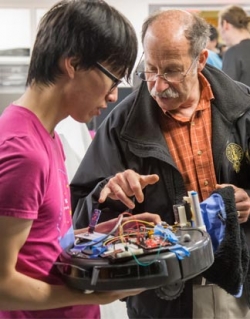 Jonathan Zong demonstrates his final projects during an open house.