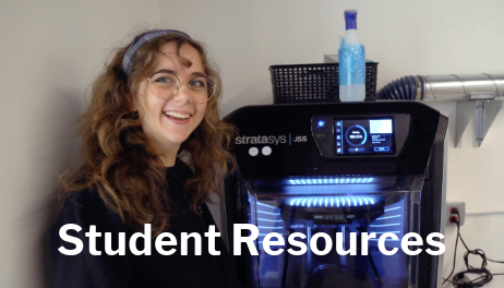 Student Resources - Student smiling in front of 3D printer