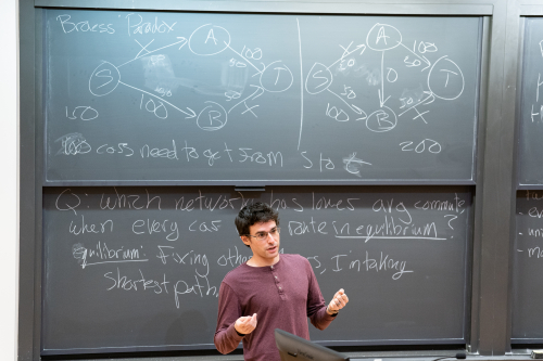 Matt Weinberg at a blackboard, teaching